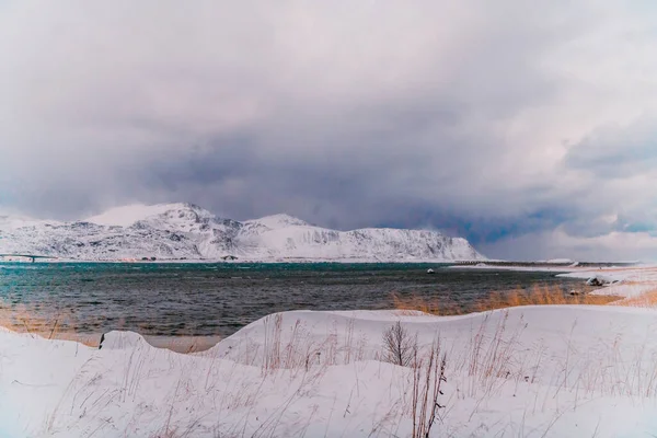 Norway coast in winter with snow bad cloudy weather. High quality photo