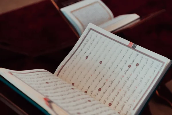 Photo of the holy Islamic book of the Qoran in a modern mosque.