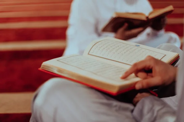 stock image A group of Muslims reading the holy book of the Quran in a modern mosque during the Muslim holiday of Ramadan. 