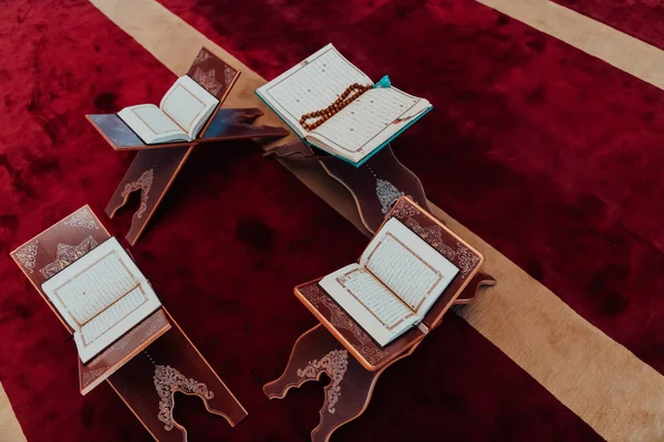 Photo of the holy Islamic book of the Qoran in a modern mosque.