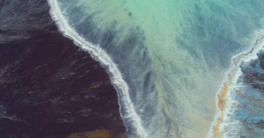 Top down aerial view over natural texture - abstract industrial lake water patterns. Turquoise waternature poluttion. Hi quality 4K footage. 