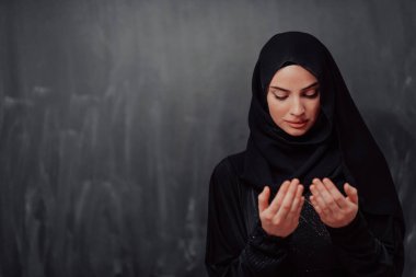 Portrait of young Muslim woman making dua. High quality photo