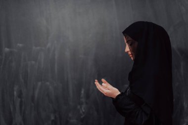 Portrait of young Muslim woman making dua. High quality photo