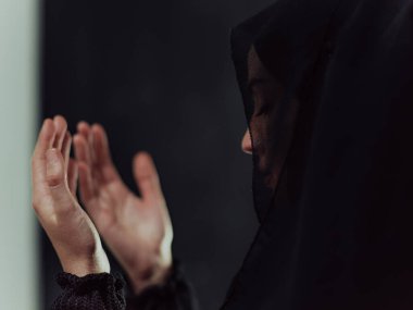 Portrait of young Muslim woman making dua. High quality photo