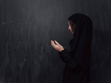 Portrait of young Muslim woman making dua. High quality photo