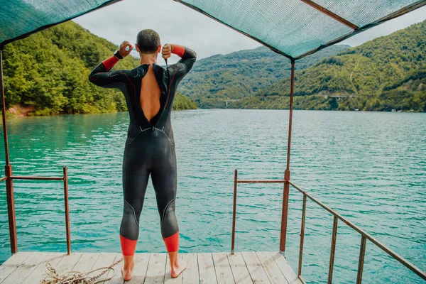 Athlete Putting Swimming Suit Preparing Triathlon Swimming Training River Surrounded — Stock Photo, Image