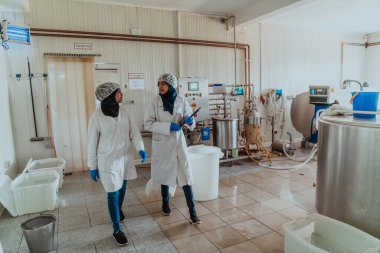  Arab business partner visiting a cheese factory. The concept of investing in small businesses. 