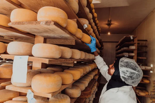 an Arab investor in a warehouse of the cheese production industry.