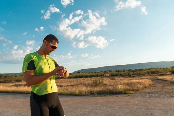 Triathlete Checking His Training Statistics Smartwatch Analyzing His Performance Progress — Stock Photo, Image