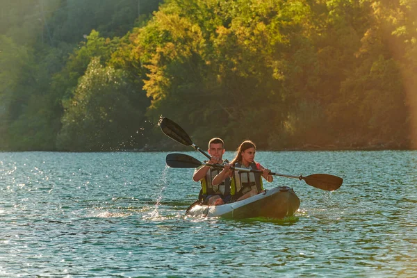 Young Couple Enjoying Idyllic Kayak Ride Middle Beautiful River Surrounded Royalty Free Stock Images