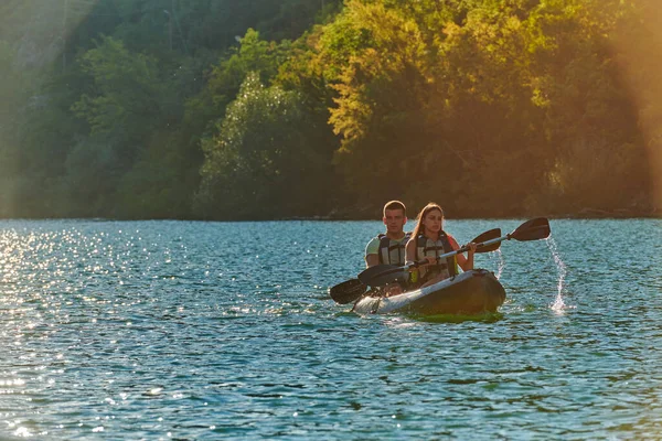 Young Couple Enjoying Idyllic Kayak Ride Middle Beautiful River Surrounded Stock Photo
