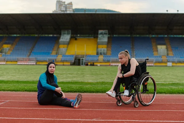 Two Strong Inspiring Women One Muslim Wearing Burka Other Wheelchair — Stock Photo, Image