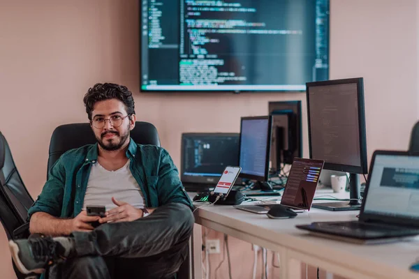 Programmer Diligently Testing Smartphone Applications While Sitting Office High Quality — Stock Photo, Image