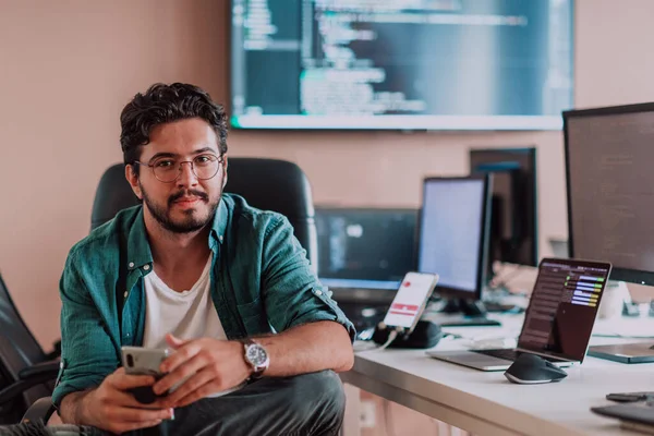 Programmer Diligently Testing Smartphone Applications While Sitting Office High Quality — Stock Photo, Image