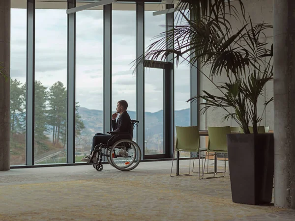 Melancholic Businessman Wheelchair Sitting Sad Expression Gazing Window Modern Office — Stock Photo, Image