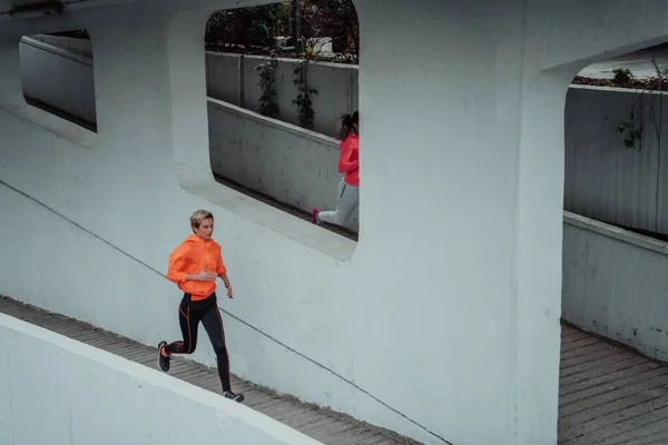 Two Women Sports Clothes Running Modern Urban Environment Concept Sporty — Foto de Stock
