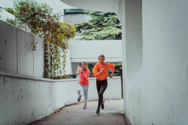 Two Women Sports Clothes Running Modern Urban Environment Concept Sporty — Stock Fotó