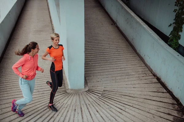 Two Women Sports Clothes Running Modern Urban Environment Concept Sporty — Stock fotografie