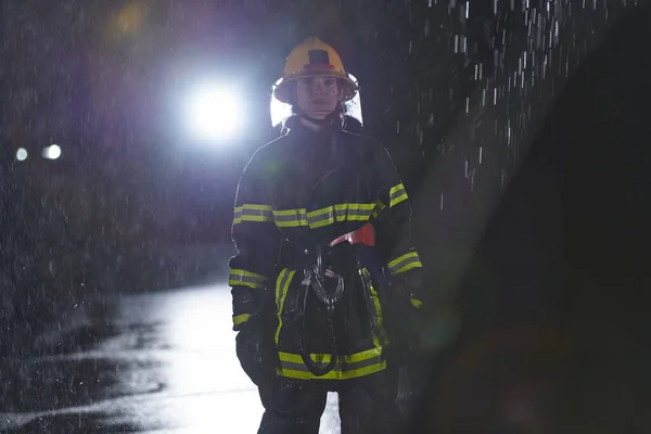 Determined Female Firefighter Professional Uniform Striding Dangerous Rainy Night Daring — Stock Photo, Image