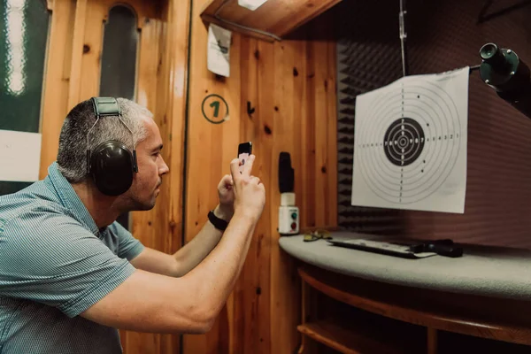 Man Shooting Range Takes Picture Examines Results Shooting High Quality — Stock Photo, Image