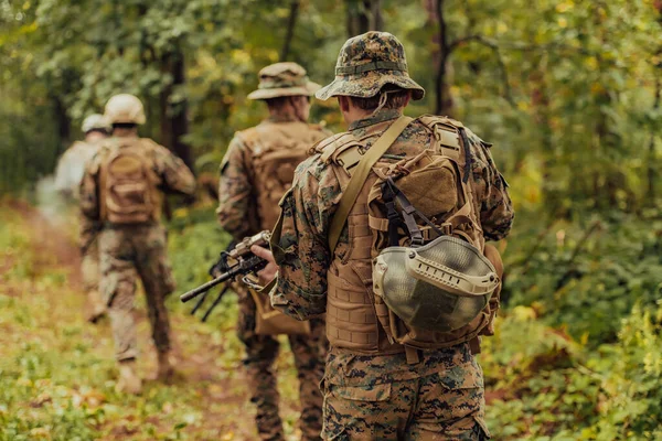 Modern warfare Soldiers Squad Running as Team in Battle Formation.
