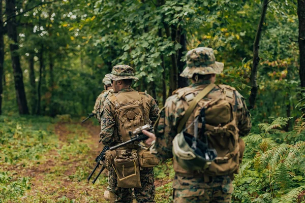 Modern warfare Soldiers Squad Running as Team in Battle Formation.