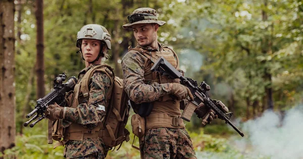 Modern Warfare Soldiers Squad Running in Tactical Battle Formation Woman as a Team Leader.
