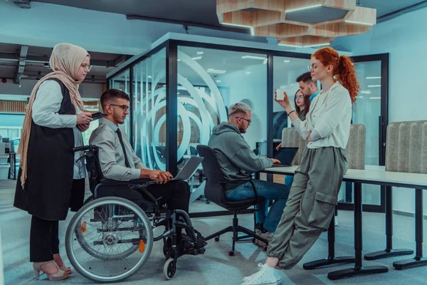 stock image Young group of business people brainstorming together in a startup space, discussing business projects, investments, and solving challenges