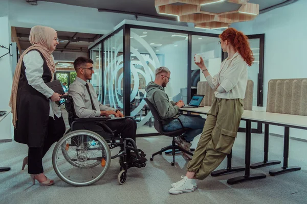 stock image Young group of business people brainstorming together in a startup space, discussing business projects, investments, and solving challenges