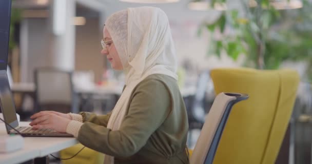 Businesswoman Hijab Seen Working Computer Modern Office Highlighting Inclusivity Professionalism — Stock Video