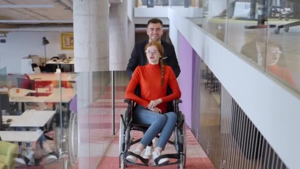 Company Director Assists His Business Colleague Wheelchair Helping Her Navigate — Stock Video