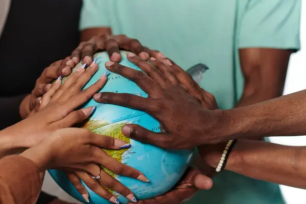 Close up of diverse teenagers hands delicately exploring a globe, capturing the essence of curiosity and exploration in their tactile engagement with geographical knowledge.