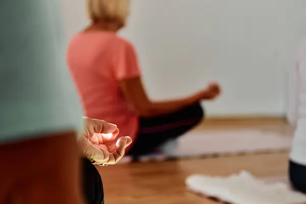 Sunlit Space Senior Womans Hand Gracefully Engages Various Yoga Poses — Stock Photo, Image