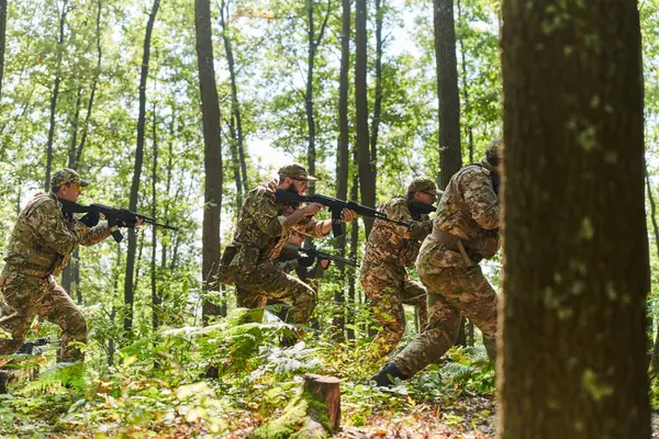 stock image A disciplined and specialized military unit, donned in camouflage, strategically patrolling and maintaining control in a high-stakes environment, showcasing their precision, unity, and readiness for