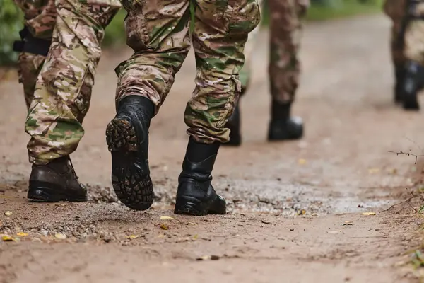 Close Photo Resilient Legs Elite Soldiers Clad Camouflage Boots Stride — Stock Photo, Image
