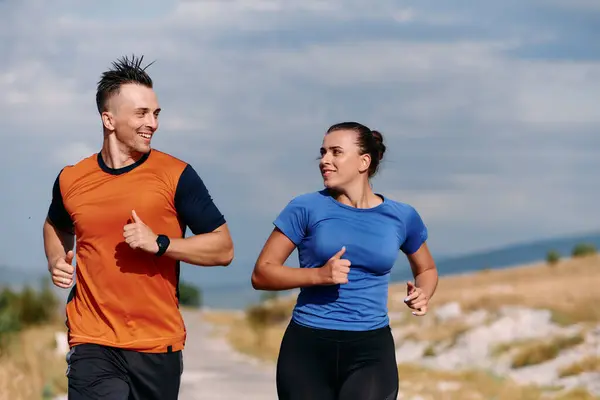 Couple Dressed Sportswear Runs Scenic Road Early Morning Workout Enjoying Royalty Free Stock Photos
