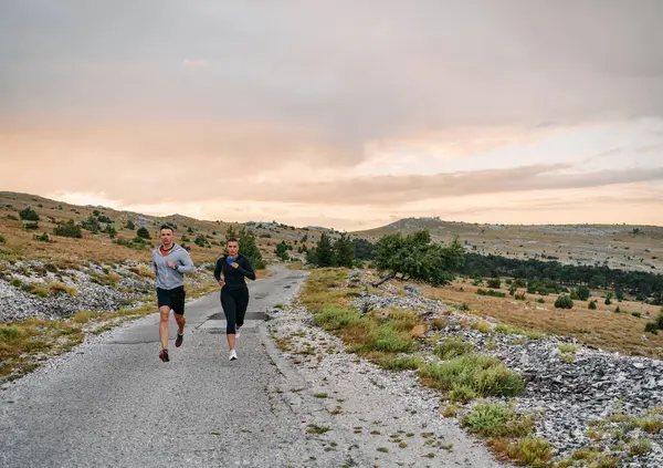 Couple Conquer Challenging Mountain Trails Invigorating Morning Run Стокове Зображення