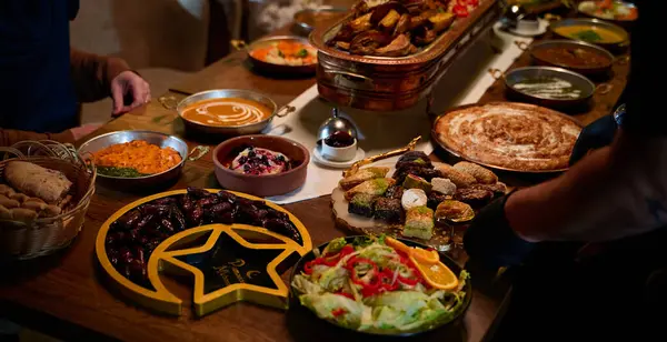 Stock image In this captivating aerial view, delicious food adorned with Ramadan decorations, including dates and meat, awaits the arrival of an European Islamic family, promising a festive and flavorful iftar