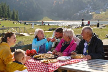 A family on a mountain vacation indulges in the pleasures of a healthy life, savoring traditional pie while surrounded by the breathtaking beauty of nature, fostering family bonds and embracing the clipart