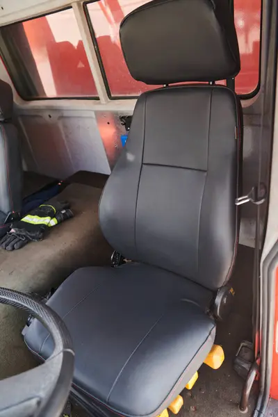 stock image The close-up capture reveals the intricate details of the ergonomic seats and high-tech interior of a modern firefighting truck, showcasing a perfect blend of functionality and safety features. 