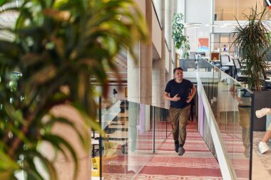 In the hustle and bustle of a modern startup office, a determined businessman sprints towards his office, embodying the fast-paced, ambitious spirit of contemporary entrepreneurship.  clipart