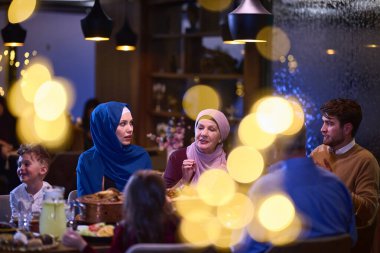 A modern and traditional European Islamic family comes together for iftar in a contemporary restaurant during the Ramadan fasting period, embodying cultural harmony and familial unity amidst a clipart