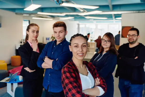 stock image Portrait of a successful creative businessman and businesswoman looking at camera and smiling. Diverse business people standing together at startup