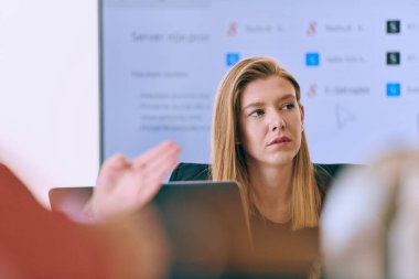 Capturing the essence of leadership and collaboration, this headshot portrait showcases a professional businesswoman attentively guiding a productive meeting with colleagues, exuding confidence and clipart