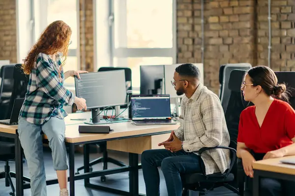 stock image A diverse group of young business individuals congregates in a modern startup coworking center, embodying collaborative innovation and a dynamic atmosphere.