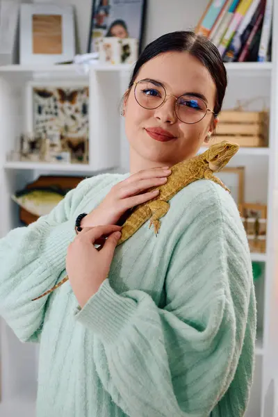 stock image A beautiful woman in a joyful moment, posing with her adorable bearded dragon pets, radiating love and companionship.