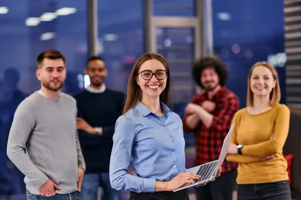 stock image A determined business team stands together with confidence, symbolizing unity and representing their company with strength and professionalism.