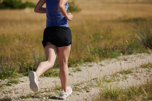 stock image Embodying strength and determination, a lone runner pursues her fitness goals with fervor, gearing up for upcoming marathon challenges while embracing a healthy lifestyle 