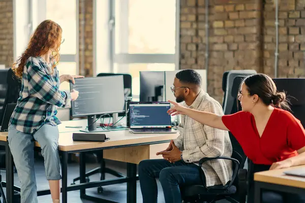 stock image A diverse group of young business individuals congregates in a modern startup coworking center, embodying collaborative innovation and a dynamic atmosphere.