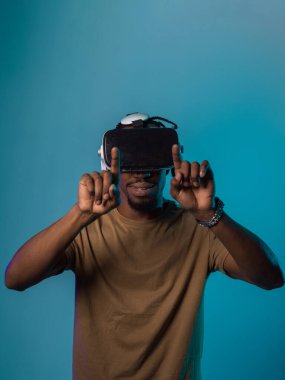 Immersed in a digital realm, an African American man navigates the virtual landscape with a VR goggles, using tactile gestures to interact with virtual objects, showcasing a harmonious blend of clipart